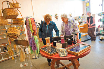 Patrons peruse works of art at Makeshift Gallery in downtown Gallup on March 23. The gallery is under new ownership and is part of a growing tide of change in downtown Gallup in the arts community. © 2011 Gallup Independent / Brian Leddy 